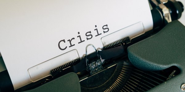 Crisis Typed On Typewriter